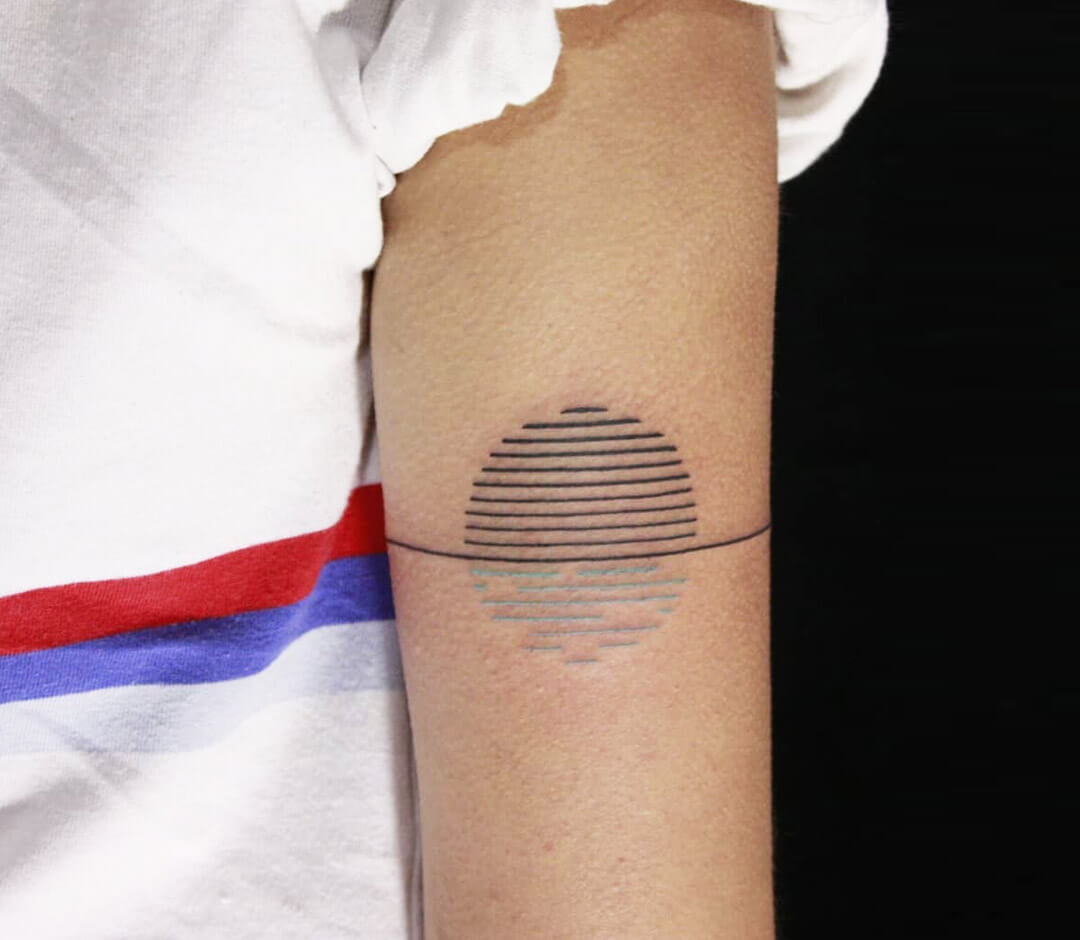 Small Sun Tattoo on Arm