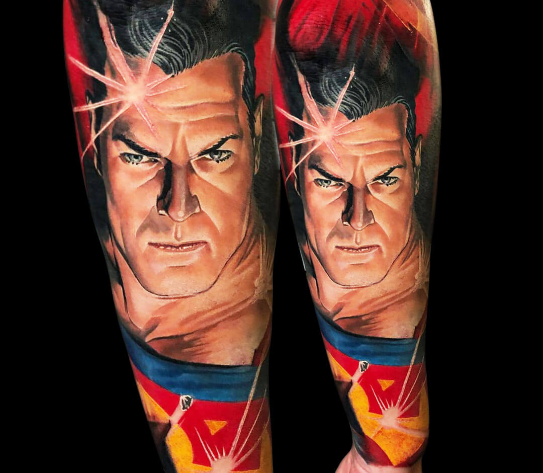 Superman tattoo on the calf.