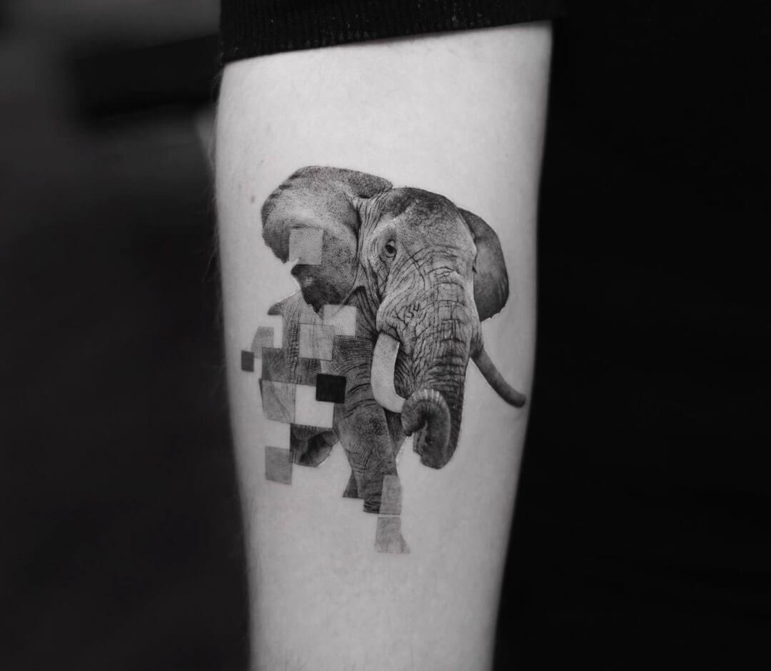 Seated elephant with raised trunk holding lilacs tattoo idea | TattoosAI