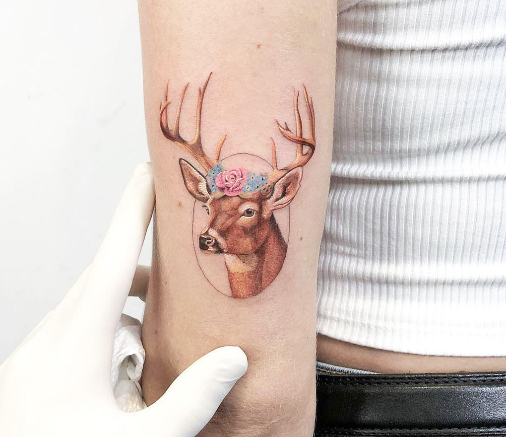 Deer tattoo on the ankle.