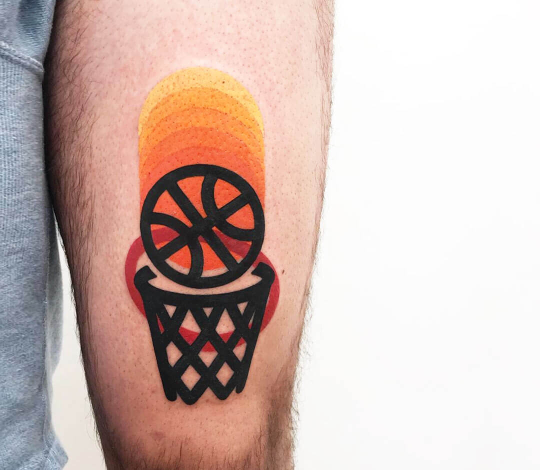 Micro-realistic basketball tattoo on the ankle.