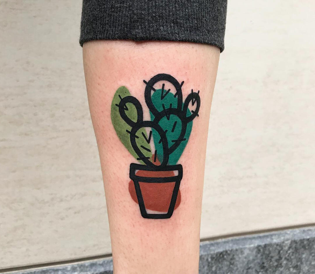 Cactus tattoos on the right inner forearm.