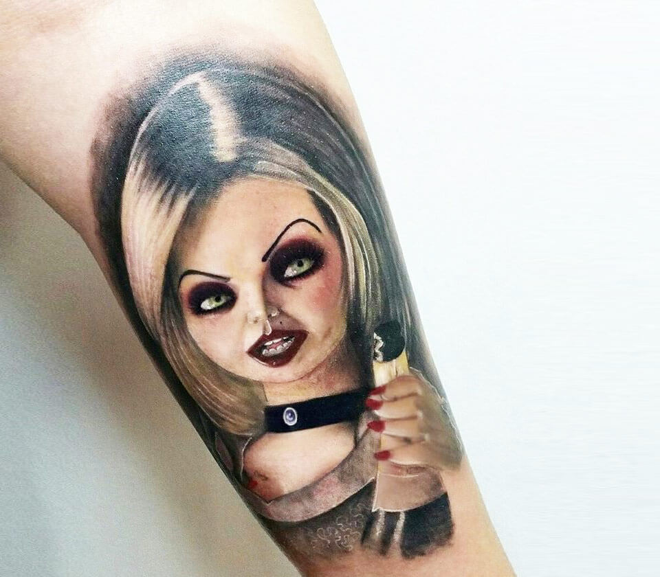 Chucky Tiffany tattoo by Andrea Morales. 