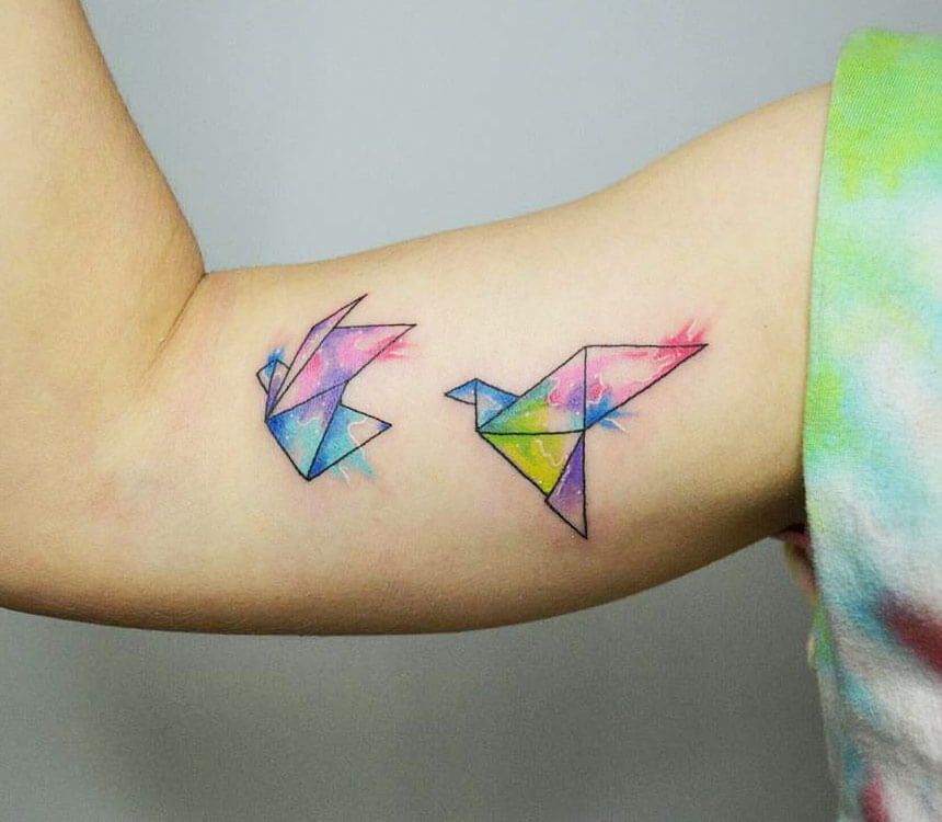 Origami Bird Tattoo With Watercolors On The Clavicle  Starry Eyed Tattoos  and Body Art Studio
