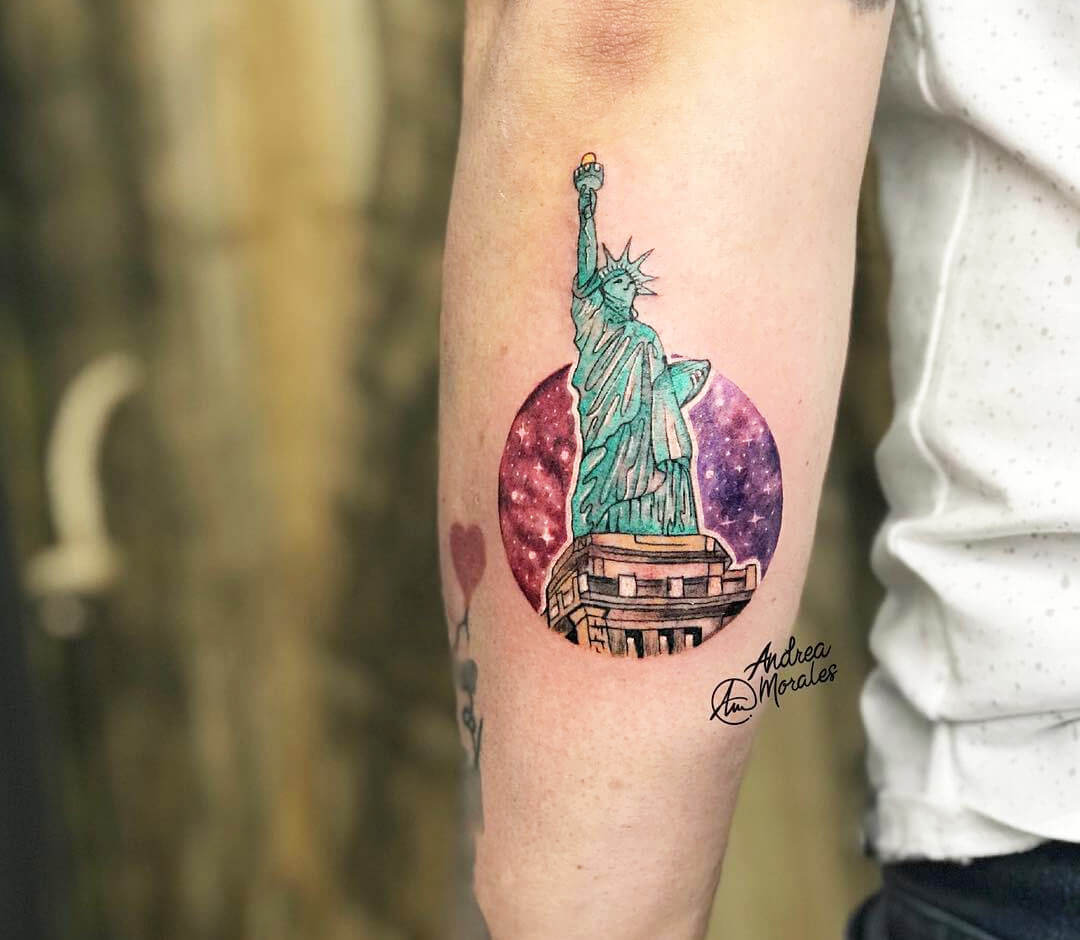 Hand poked statue of liberty tattoo ln the upper arm