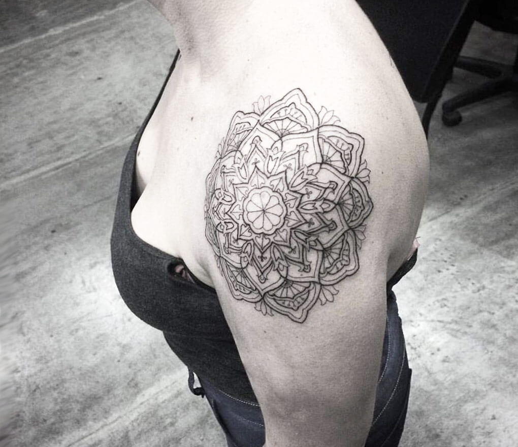 Polynesian Mandala tattoo with compass and abstract sun design