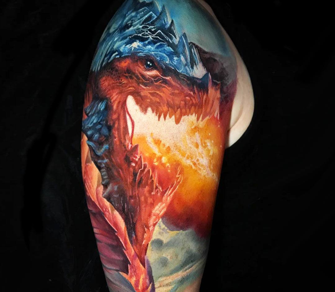 Haku dragon head tattoo on the upper arm.