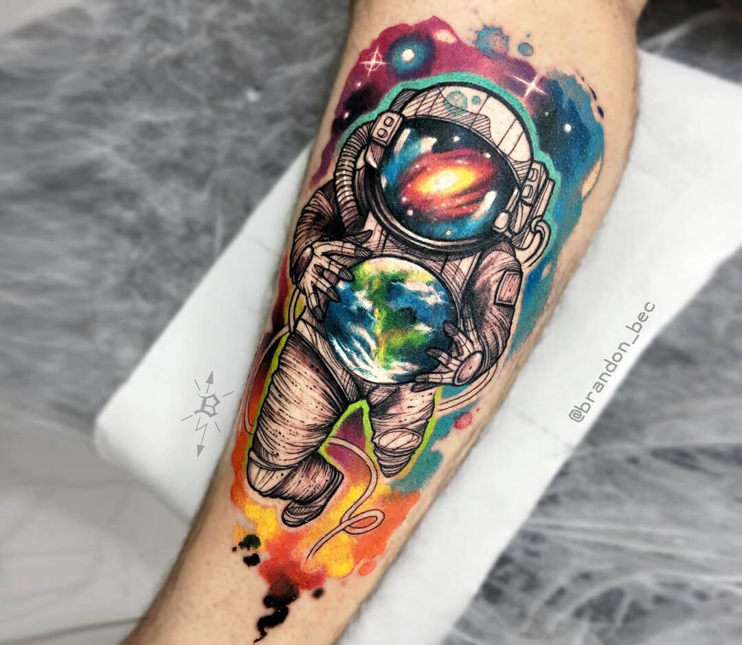 Surrealist astronaut tattoo on the calf
