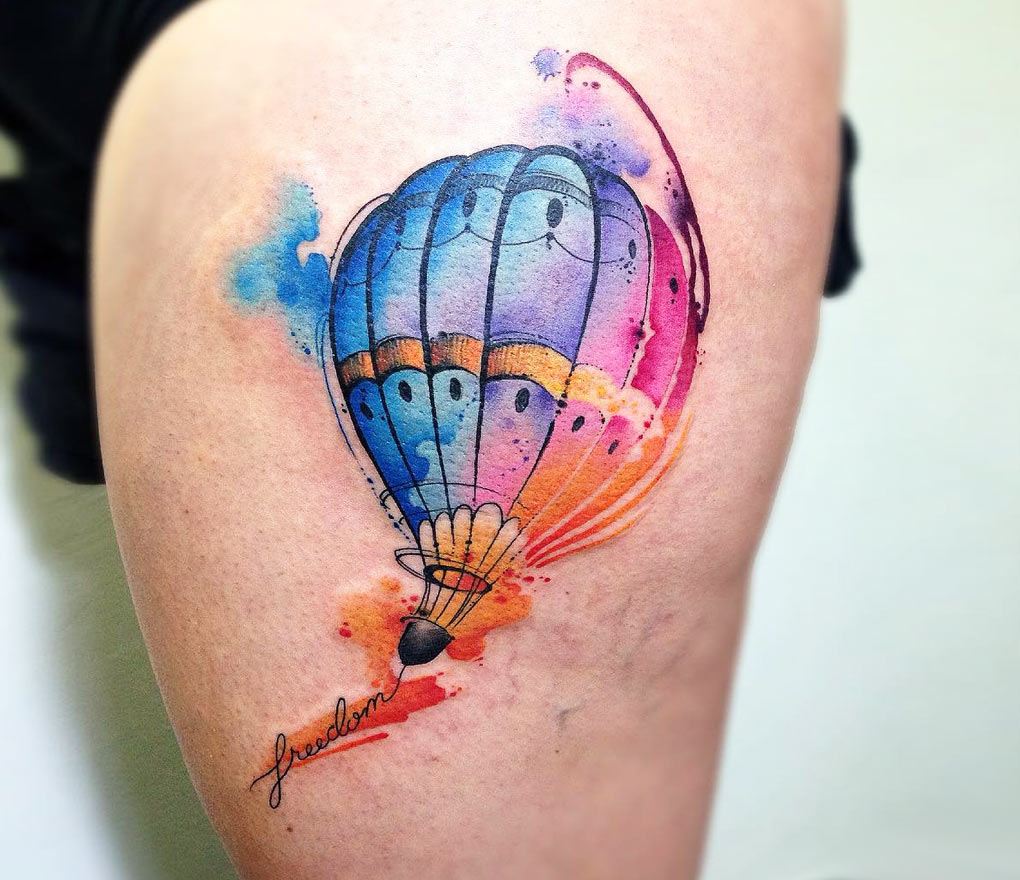Micro-realistic heart balloons tattooed on the upper