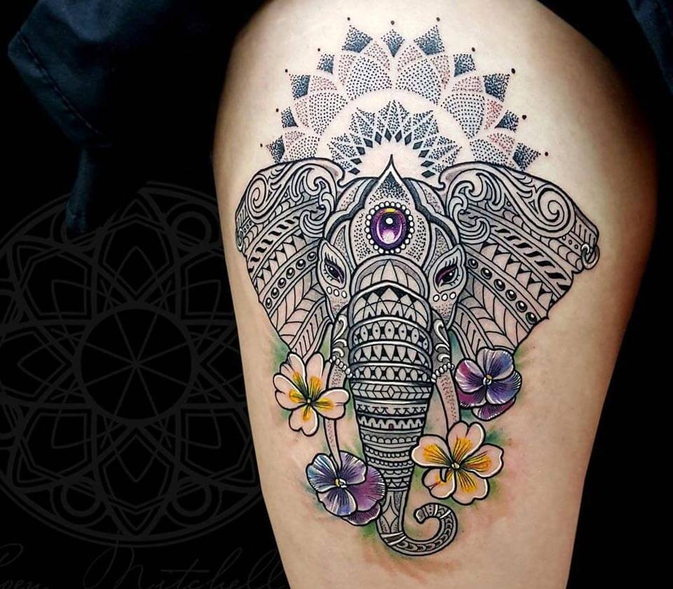 Realistic elephant tattoo on the right thigh.
