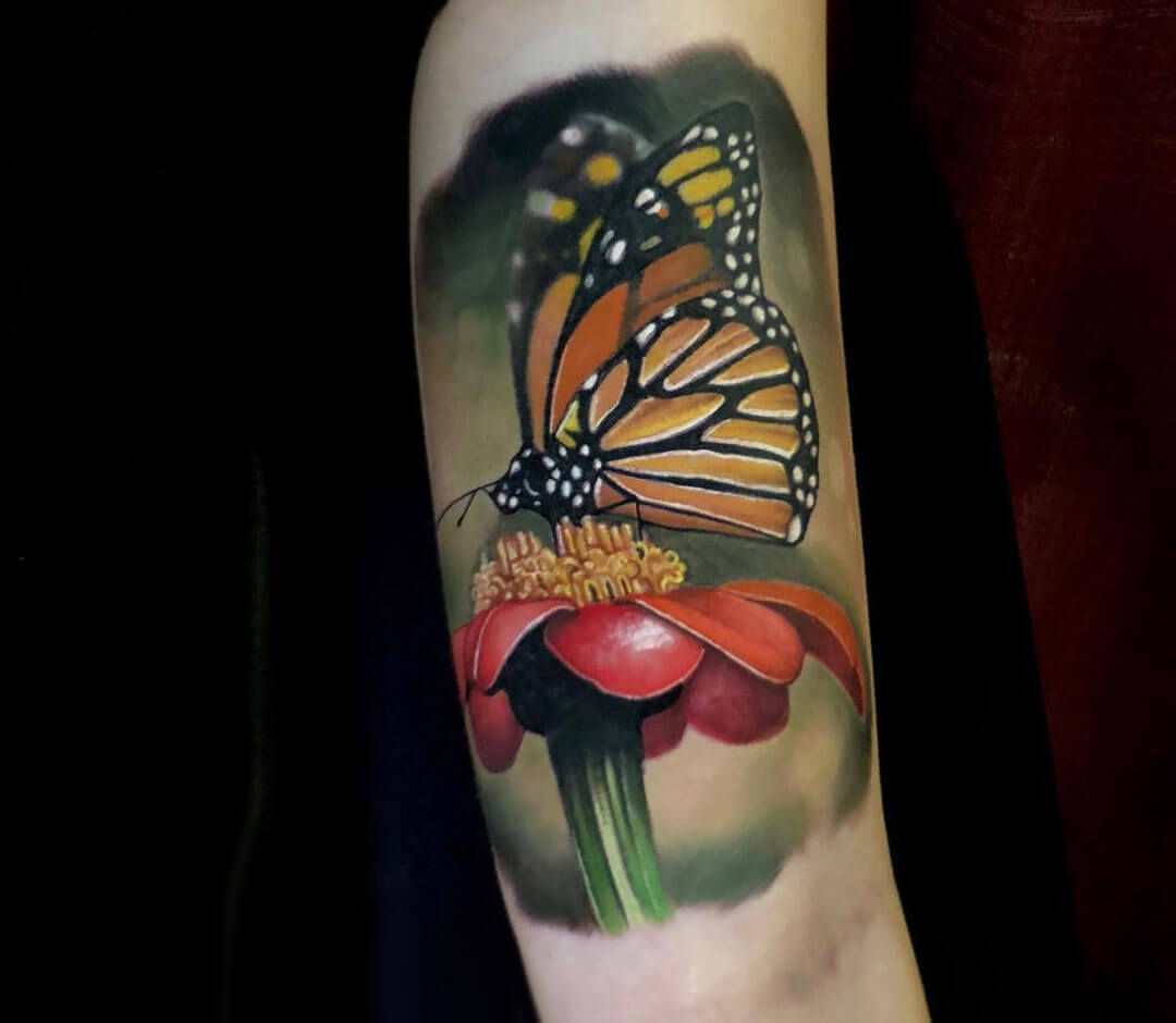 Two Daisy Flowers With Butterfly Tattoo On Leg