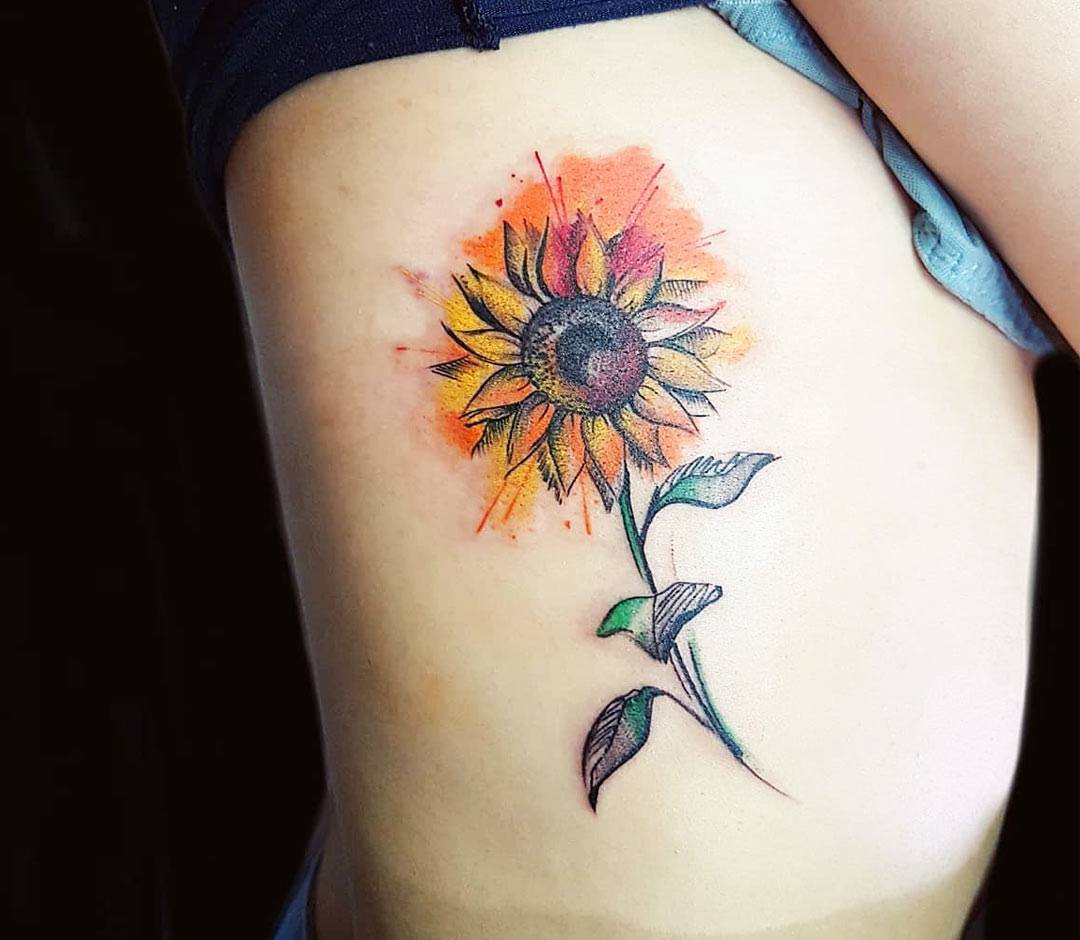 Microrealist sunflower tattoo on the inner forearm