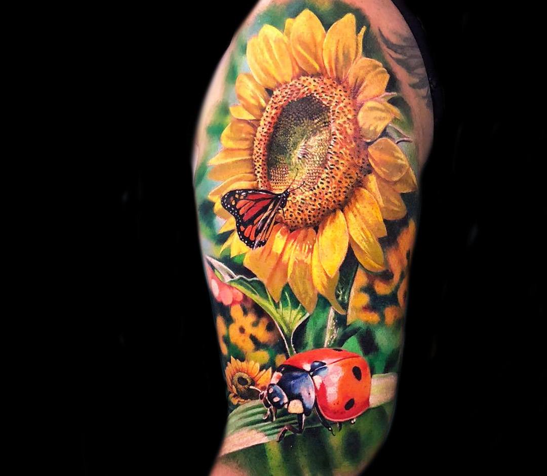 Left Arm Colored Realistic Sunflower Tattoo On Arm Sleeve