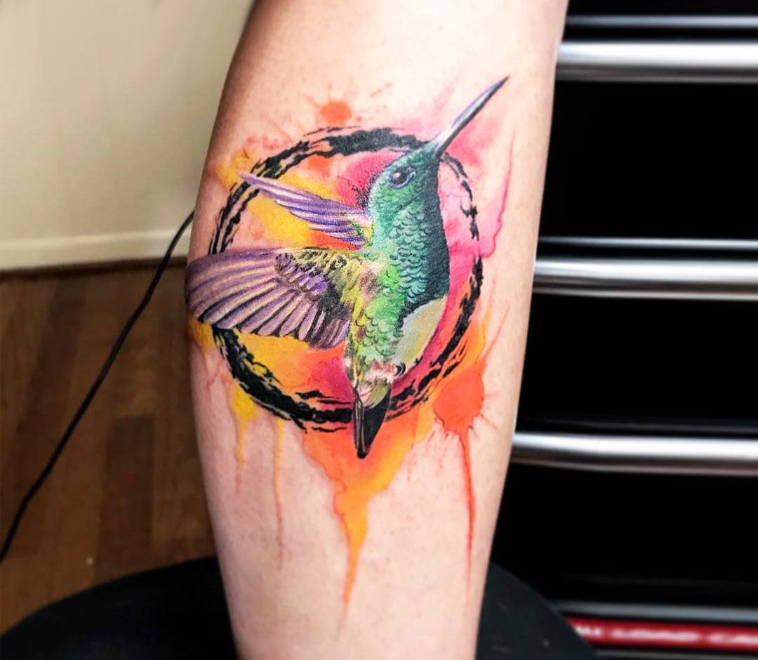 Premium Photo | Watercolor Hummingbird Tattoo Design on a Flat Surface