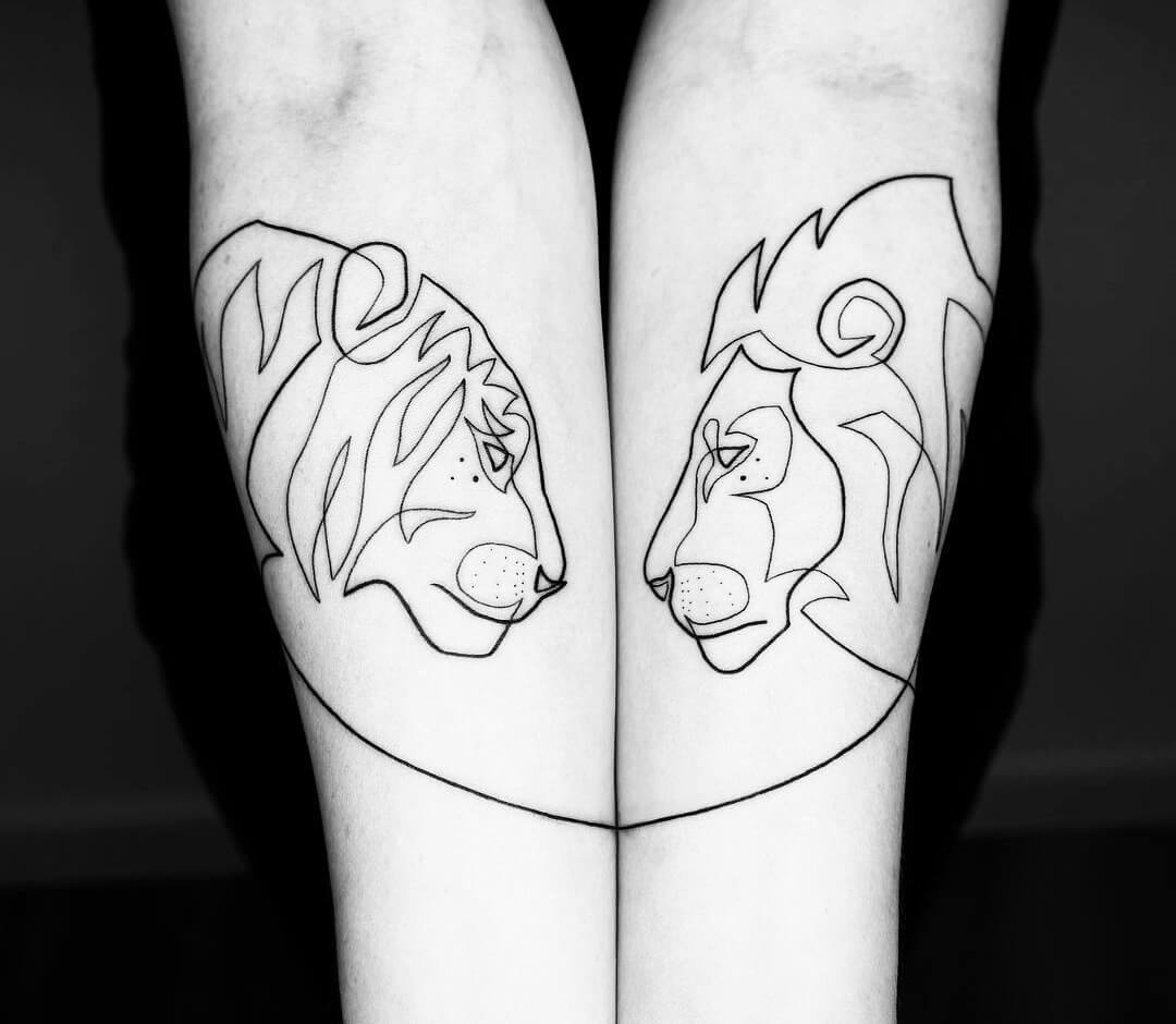 Lion and Tiger tattoo by Mo Ganji. 