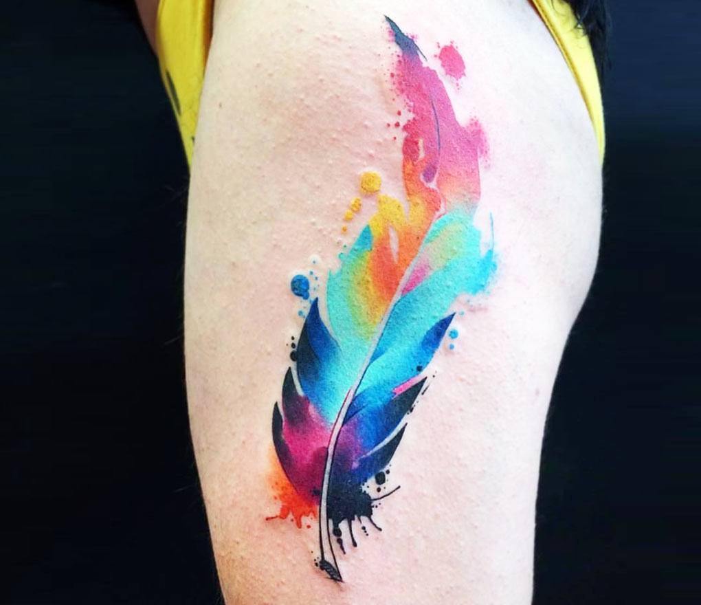 Tattoo uploaded by Jasmine Dilworth • watercolor feather coverup done a few  weeks ago! #tattoo #tattooartist #femaletattooartist #watercolor  #watercolortattoo #feathertattoo #colortattoo #colorful #rainbow  #rainbowtattoo #armtattoo #forearmtattoo ...