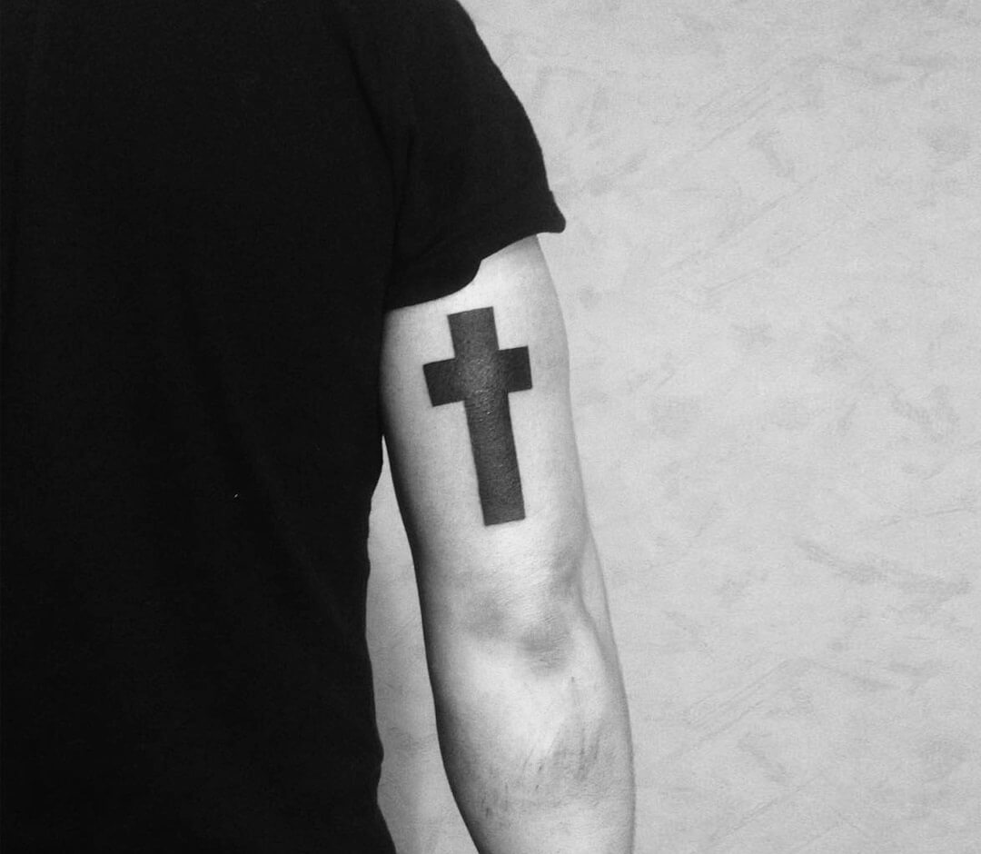Unique small black and white cross tattoo on a white background on Craiyon