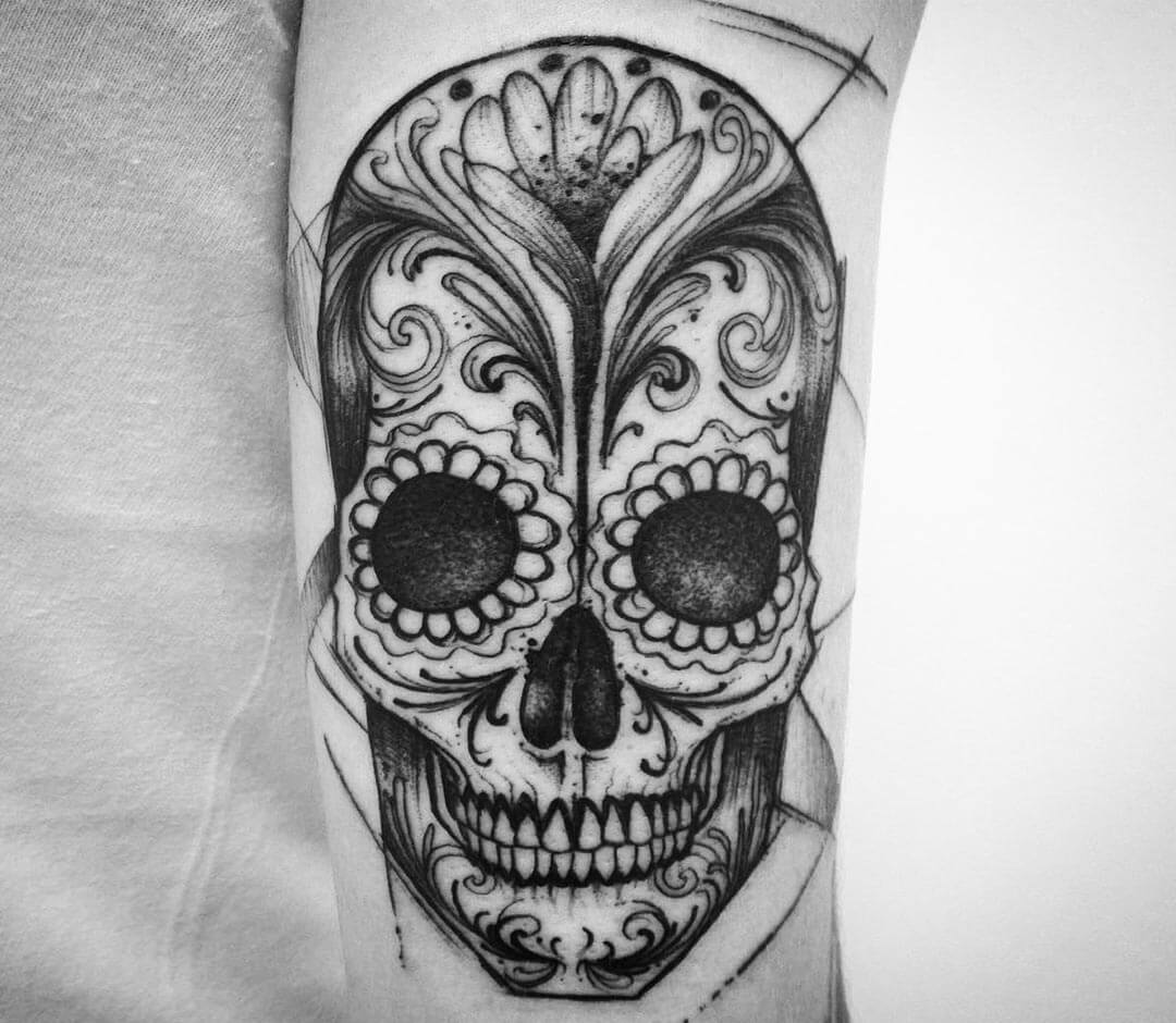 Shaded angry skull wirh fire elements tattoo idea | TattoosAI
