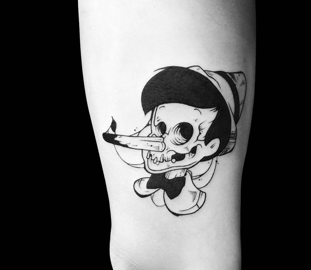 Tattoo photos Gallery. cartoon Pinocchio head tattoo art Roy Tsour. 