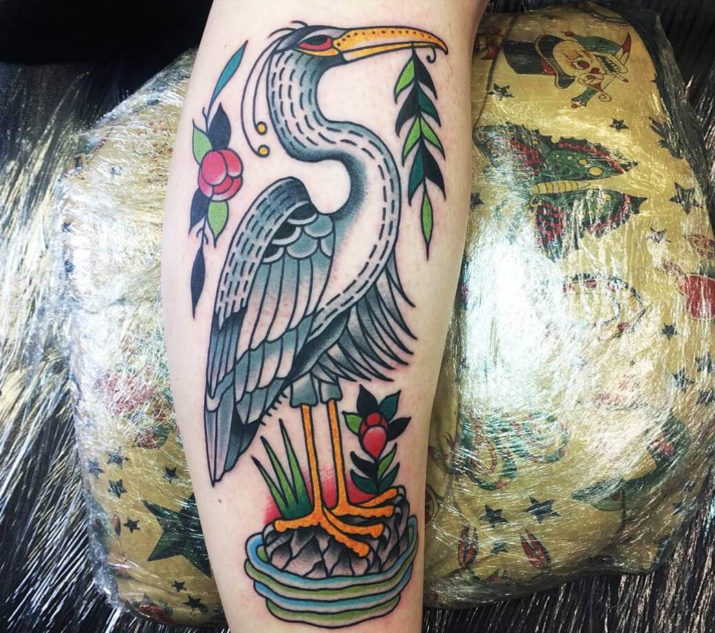 Graphic style heron tattoo on the right side of the