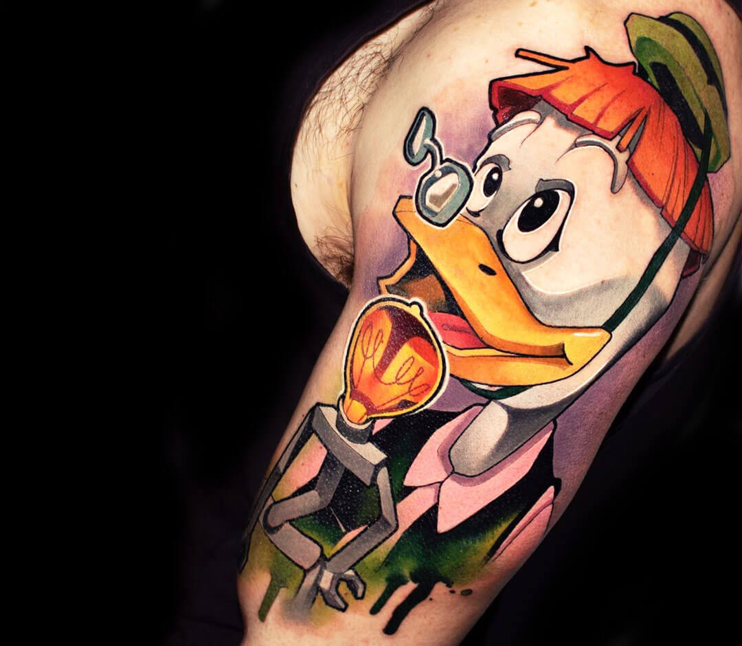 Donald Duck tattoo located on the inner forearm.