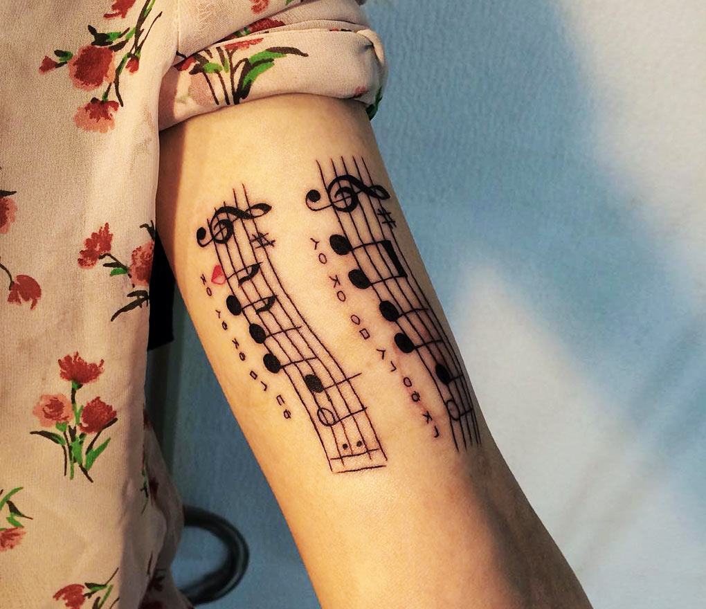Music notes tattoo by Zihee Tattoo | Photo 23781