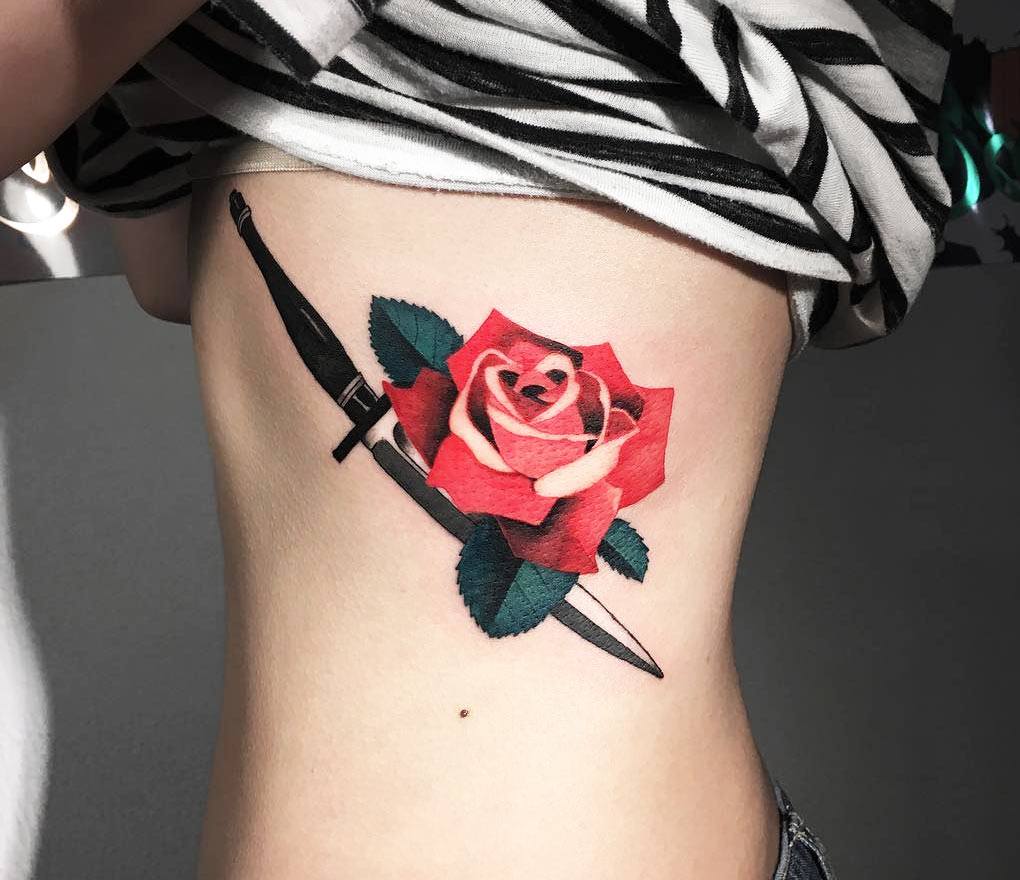 Red rose and dagger tattoo by Zihee Tattoo | Photo 25143